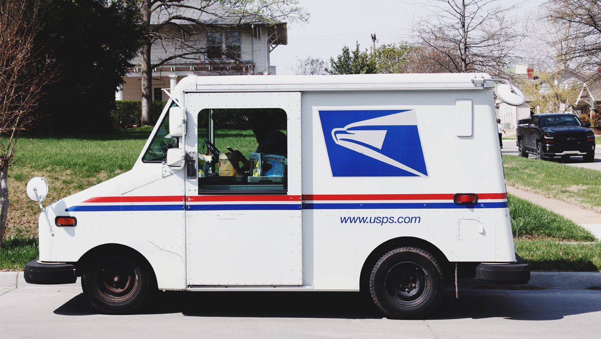 USPS Mail Delivery Truck - Photo by Pope Moysuh on Unsplash 