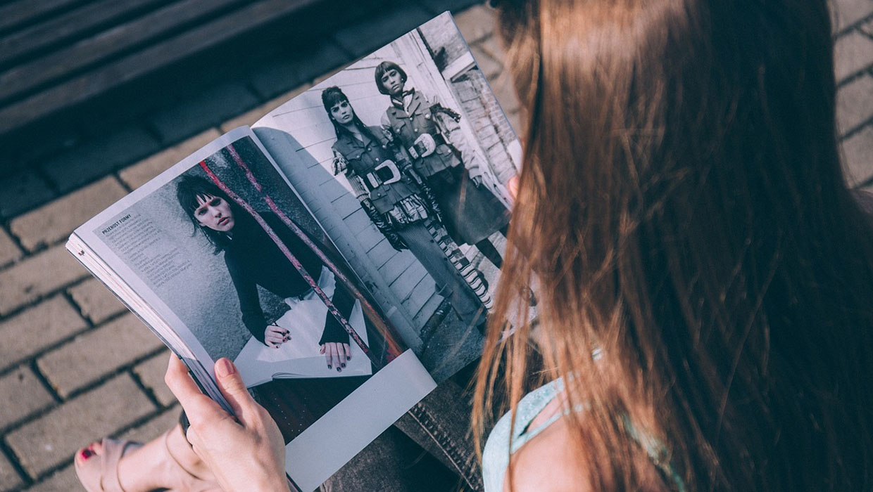 Woman reading a fashion magazine.