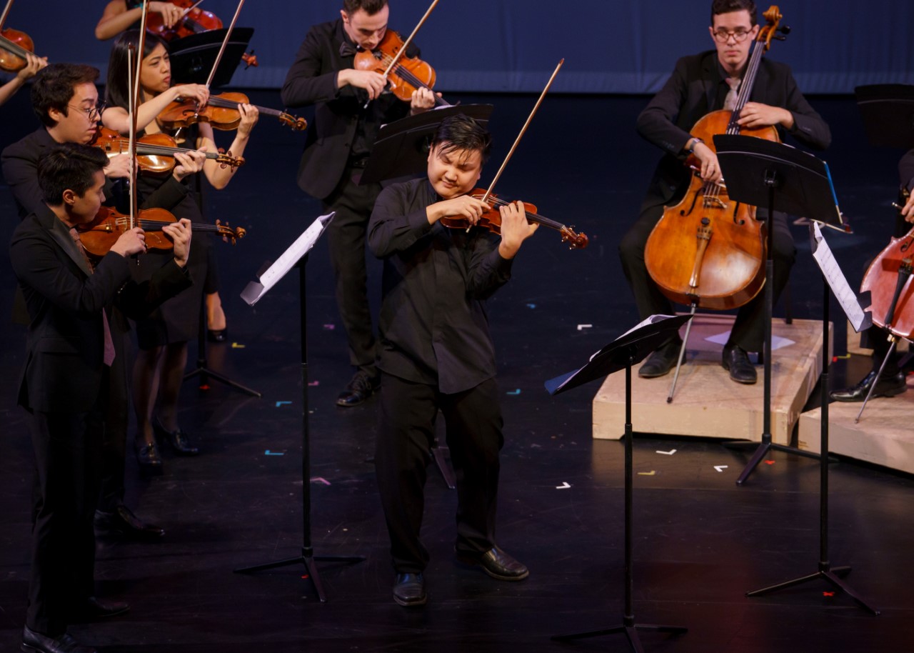 string musicians playing on stage  